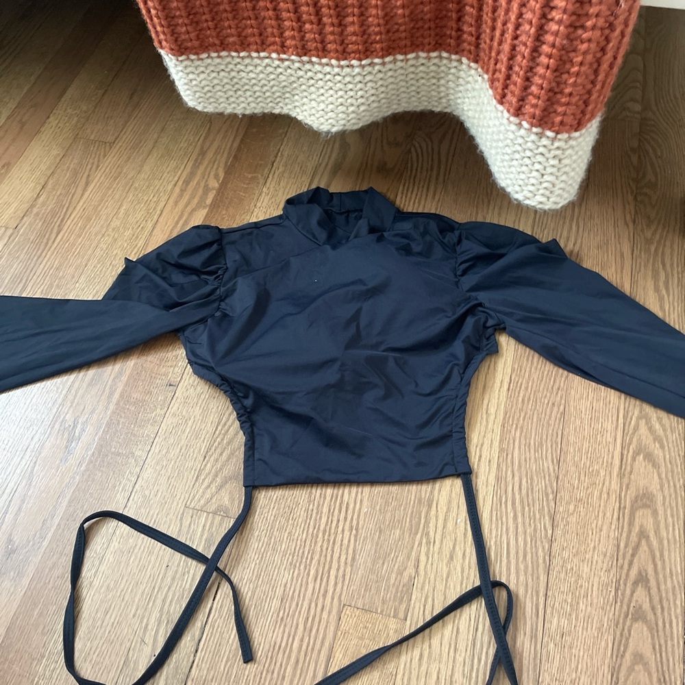 black blouse with puffy shoulders  and turtleneck in good condition size: s